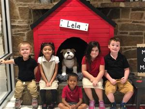 five children sitting with Lela 